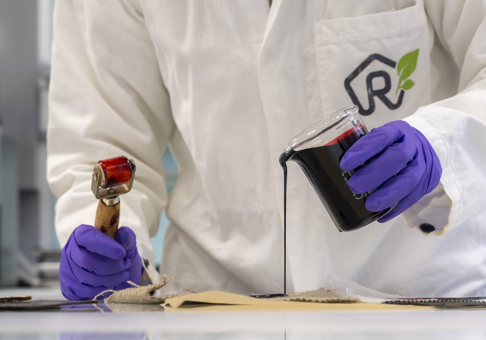 A ResiCare scientist working in the lab to develop a next-generation araminolic resin — free from formaldehyde and resorcinol. Designed for industrial applications like tire manufacturing, this bio-based adhesive solution reflects Michelin's commitment to safer, sustainable chemistry at scale.